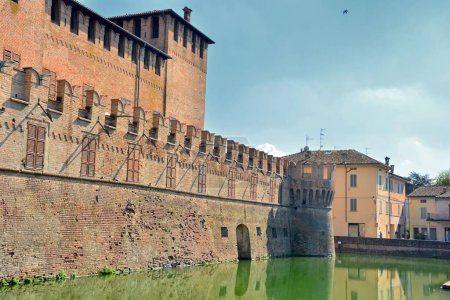 Photo for Fontanellato, Parma, Emilia-Romagna, Italy. Rocca Sanvitale. The Sanvitale fortress, also known as Fontanellato castle, is a medieval castle entirely surrounded by a moat still filled with water. - Royalty Free Image
