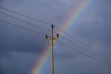 Téléchargez les photos : Old electric pole with the rainbow behind, Majorca, Balearic Islands, Spain - en image libre de droit