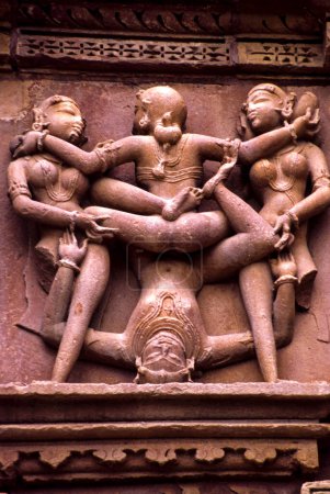 Photo for Mithuna, erotic relief in the temple of Kandariya Mahadeva(s.XI). Khajuraho.Madhya Pradesh. India. Asia. - Royalty Free Image