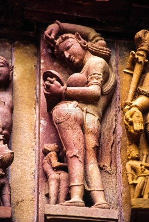 Photo for Apsara, erotic relief in the temple of Devi Jagadambi(s.X). Khajuraho.Madhya Pradesh. India. Asia. - Royalty Free Image