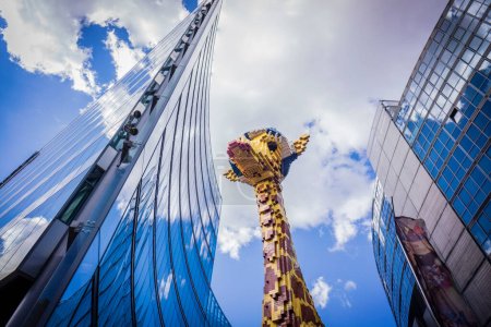 Photo for Giant giraffe built with Lego pieces, Potsdamer Platz buildings, Berlin, germany, europe - Royalty Free Image