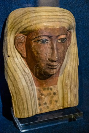 Photo for Egyptian anthropomorphic coffin face, stuccoed and polychrome wood, late period , Spain - Royalty Free Image