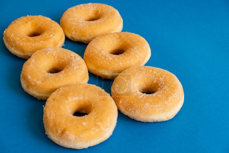 Photo for Doughnuts on blue background - Royalty Free Image