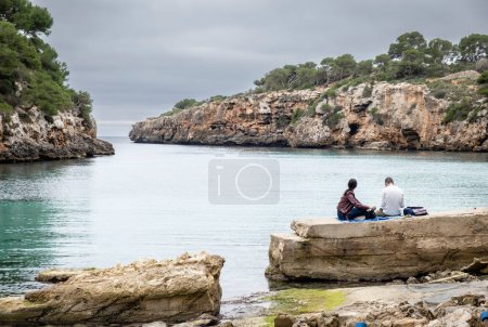 Photo for Couple enjoying the seascape, Cala Pi, Llucmajor, Mallorca, Balearic Islands, Spain - Royalty Free Image