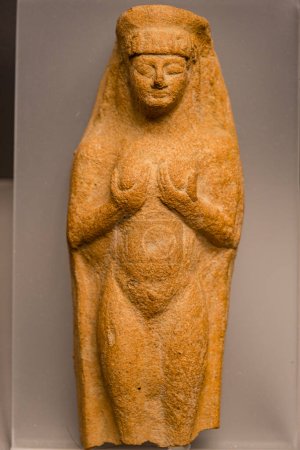 Photo for Small plaque in the shape of a female, from Tharros, clay, 6th-5th cent. BCE, Cagliari museo archeologico nazionale, The Coliseum ,   Rome, Lazio, Italy , - Royalty Free Image