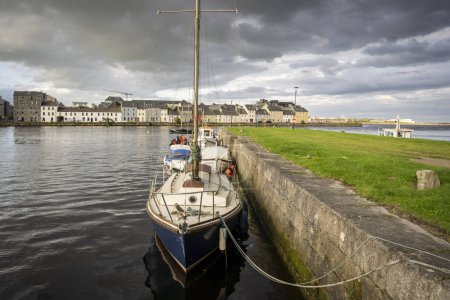 Photo for Boat anchored in Eglinton Canal Sea Lock, The Long Walk, Galway, Ireland, United Kingdom - Royalty Free Image