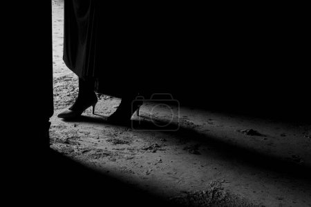 Foto de Black and white silhouette and shadow of woman wearing dress. Loneliness concept, dramatic human life - Imagen libre de derechos
