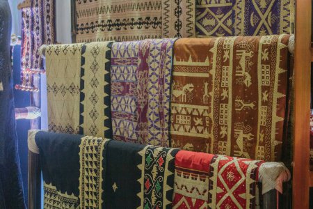 Photo for Fabric Various motifs. different fabrics displayed on the shelves. a fabric that can be called a typical tapis fabric from the province of Lampung in Indonesia. - Royalty Free Image