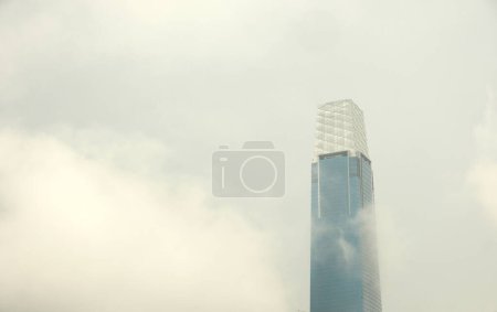 Photo for Kuala Lumpur, Malaysia-Circa December, 2022: Selective focus picture of Tun Razak Exchange during raining day with moving cloud insight. - Royalty Free Image