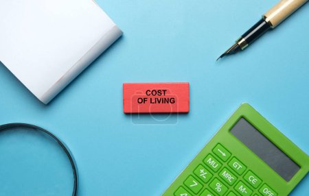 Photo for A picture of cost of analysis wooden block, calculator, notebook, pen and magnifying glass - Royalty Free Image