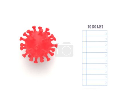 Photo for A picture of covid-19 virus with to do list paper on white background. - Royalty Free Image