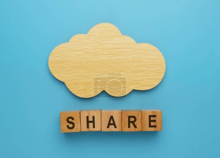 Photo for A picture of wooden cloud with wooden block written share. Cloud share concept. - Royalty Free Image