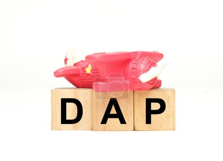 A picture of toy aeroplane with wooden block DAP. Delivery at place incoterms.