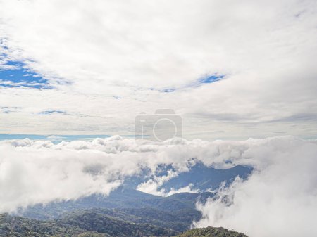 Beautiful scenic view of mountains and clouds against the sky in Kew Mae Pan nature trail at Doi Inthanon, Chiang Mai, Thailand. Famous tourist attractions of Thailand. Concept of holiday and travel.