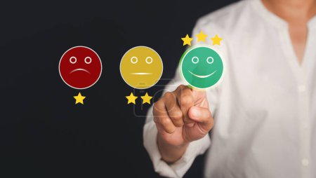 Photo for Customer feedback, service evaluation, and satisfaction conceptual. Business people pressing smiley face emoticon on the virtual touch screen. - Royalty Free Image