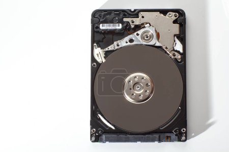 A hard drive from a computer without a cover.