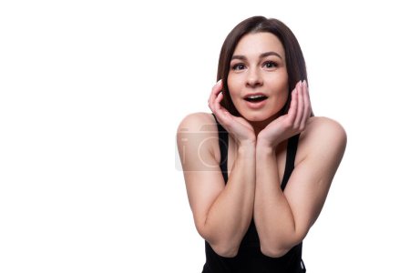 Photo for 25 year old woman with black hair is surprised and opens her mouth. - Royalty Free Image