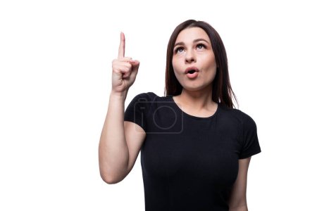 Photo for Young slim brunette woman inspired by an idea and holding a thumbs up. - Royalty Free Image