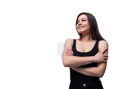 Photo for Casual pretty young brunette woman wearing a black t-shirt on a white background. - Royalty Free Image