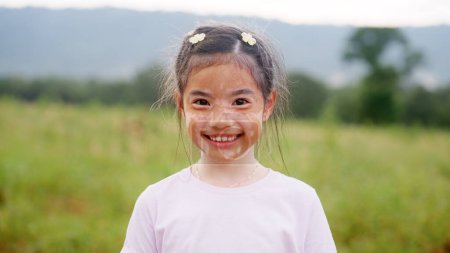 Photo for Little cute alpha young albino vitiligo small school girl relax smile look at camera. Real melanin face body skin care hair color of asia people gen z kid in self love happy proud of diverse beauty. - Royalty Free Image