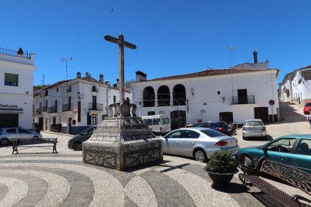 Photo for Fuenteheridos, Huelva, Spain, April 26, 2023: Monument with a cross in the square of Fuenteheridos, Huelva, Spain - Royalty Free Image