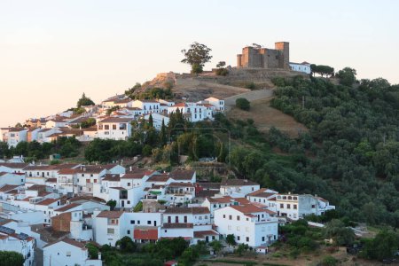 Photo for Cortegana, Huelva, Spain, May 12, 2023: View of the white houses and the castle of the magical Andalusian town of Cortegana, Huelva, Spain - Royalty Free Image