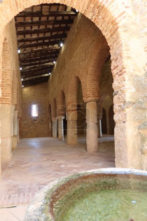Photo for Almonaster la Real, Huelva, Spain, June 21, 2023: Entrance arch and ablutions courtyard of the 10th century mosque in Almonaster la Real. Huelva, Spain - Royalty Free Image