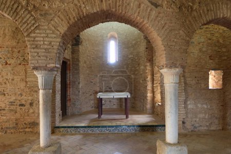 Photo for Almonaster la Real, Huelva, Spain, June 21, 2023: Altar in the 13th century Romanesque apse of the 10th century mosque of Almonaster la Real. Huelva, Spain - Royalty Free Image