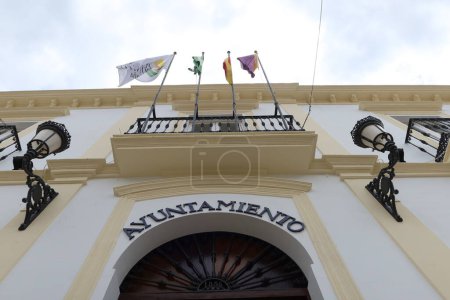 Photo for Almonaster la Real, Huelva, Spain, June 21, 2023: Flags at the Town Hall of Almonaster la Real, Sierra de Aracena, Huelva, Spain - Royalty Free Image