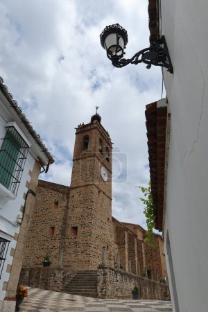Photo for Almonaster la Real, Huelva, Spain, June 21, 2023: Bell tower of the church of San Martin in Almonaster la Real, Sierra de Aracena, Huelva, Spain - Royalty Free Image