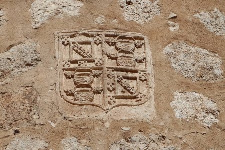 Villena, Alicante, Spain, March 6, 2024: Shield on one of the walls of the medieval castle of Arab origin of the Atalaya. Villena, Alicante, Spain