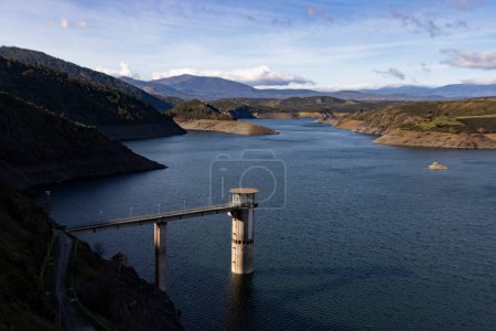 Photo for Reservoir. Prey. Dam located in the Atazar, north of the Community of Madrid. Damned water next to some green and pink mountains. Horizontal Photography - Royalty Free Image