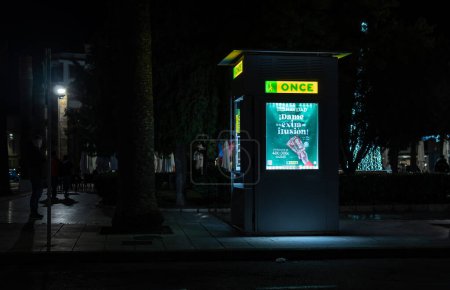 Photo for Felanitx, Spain; december 10 2022: Lottery stand of the Spanish National Organization for the Blind, Once, illuminated at night - Royalty Free Image