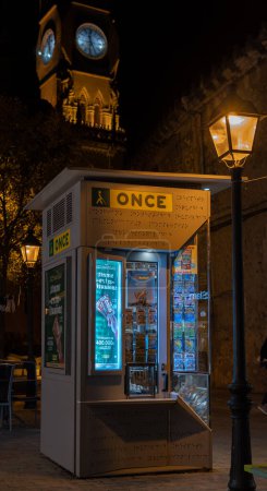 Photo for Manacor, Spain; december 17 2022: Lottery stand of the Spanish National Organization for the Blind, Once, illuminated at night - Royalty Free Image