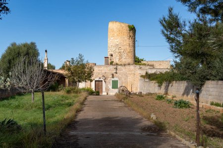 Photo for Felanitx, Spain; january 05 2023: Old stone mill converted into a house called molino de n'hereu, in the Majorcan town of Felanitx, Spain - Royalty Free Image