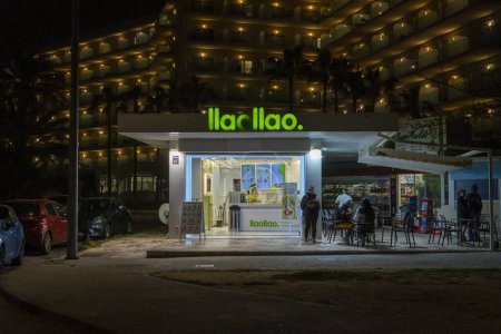 Photo for Palma de Mallorca, Spain; march 29 2024: Main facade of the multinational ice cream company Lao Lao, in the tourist beach area of Palma de Mallorca at night - Royalty Free Image