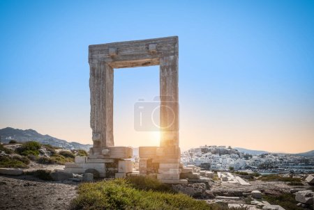  Temple of Apollo ruin at sunset. Portara gate on Naxos Island, Greece.