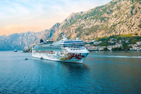 Photo for KOTOR, MONTENEGRO - SEPTEMBER 5, 2022: Cruise ship Norwegian Gem of NCL Norwegian Cruise line sailing away from Kotor, Montenegro. - Royalty Free Image