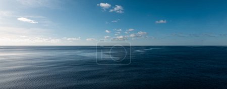 Panoramic sea view with calm sea and blue sky. Tranquil seascape. Indian Ocean.