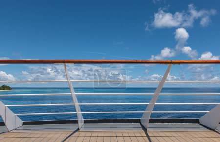 Cruise ship railing with sea view.