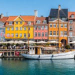 Copenhagen, Denmark - July 8, 2023: Colorful houses along the canal in Nyhavn, Copenhagen.