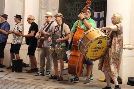 Photo for Ferrara, Italia - August 26, 2022: The Ferrara Buskers Festival is dedicated to the art of the street. Roamin Street Band performs street music in New Orleans style with his own personal touch. - Royalty Free Image