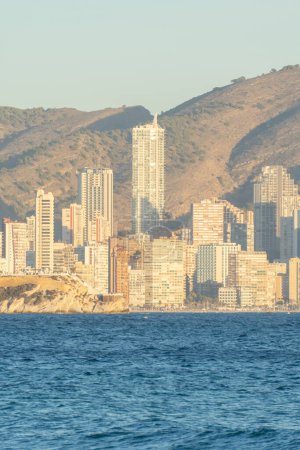 Skyline of the city of Benidorm. Skyscrapers of the city photographed from the sea. Tall buildings facing the sea.