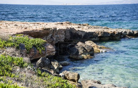 Mediterranean landscape - stone ledge in the sea.Greece, island Aegina