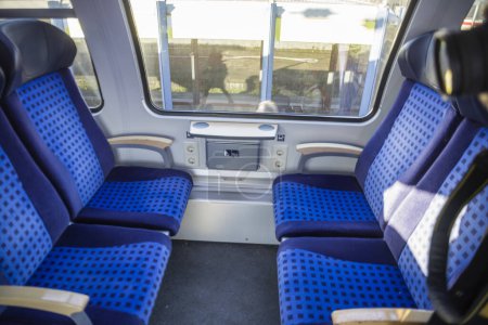 four blue seats on a train in Germany