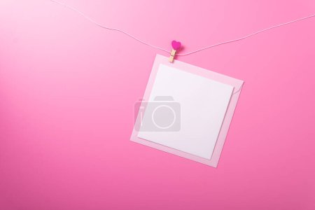 Photo for Envelope pink background rose valentines day celebrate holiday top angle top view mockup red heart - Royalty Free Image