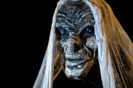 Close-up of witch face on a dark halloween horror night background