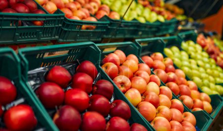 Photo for Crates of fresh fruit such as apples are for sale in the store. Buying vegetables and fruits at the market. - Royalty Free Image