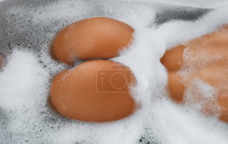Photo for Back view of beautiful young sexy woman enjoying pleasant bath with foam, showing sexy buttocks. Girl in the bath. Womans sexual lingerie. Beauty woman with attractive buttocks taking bath, spa. - Royalty Free Image