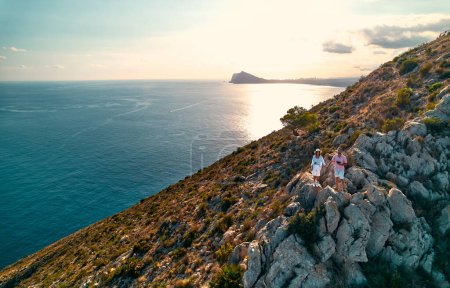 Photo for Aerial view of Calpe Comunidad Autonoma de Valencia, Spain. Travel and tourism. A couple of tourists on a cliff of a coastal city near the ocean. - Royalty Free Image